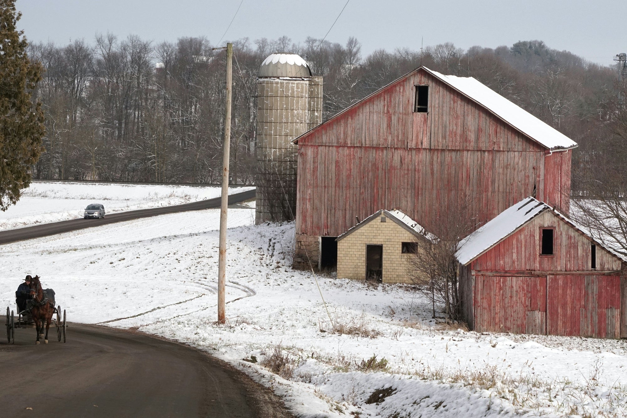 Rural Ohio red barn and silo in snowy Amish country landscape — FDM Enterprises MRI and CT scanner service coverage across Ohio