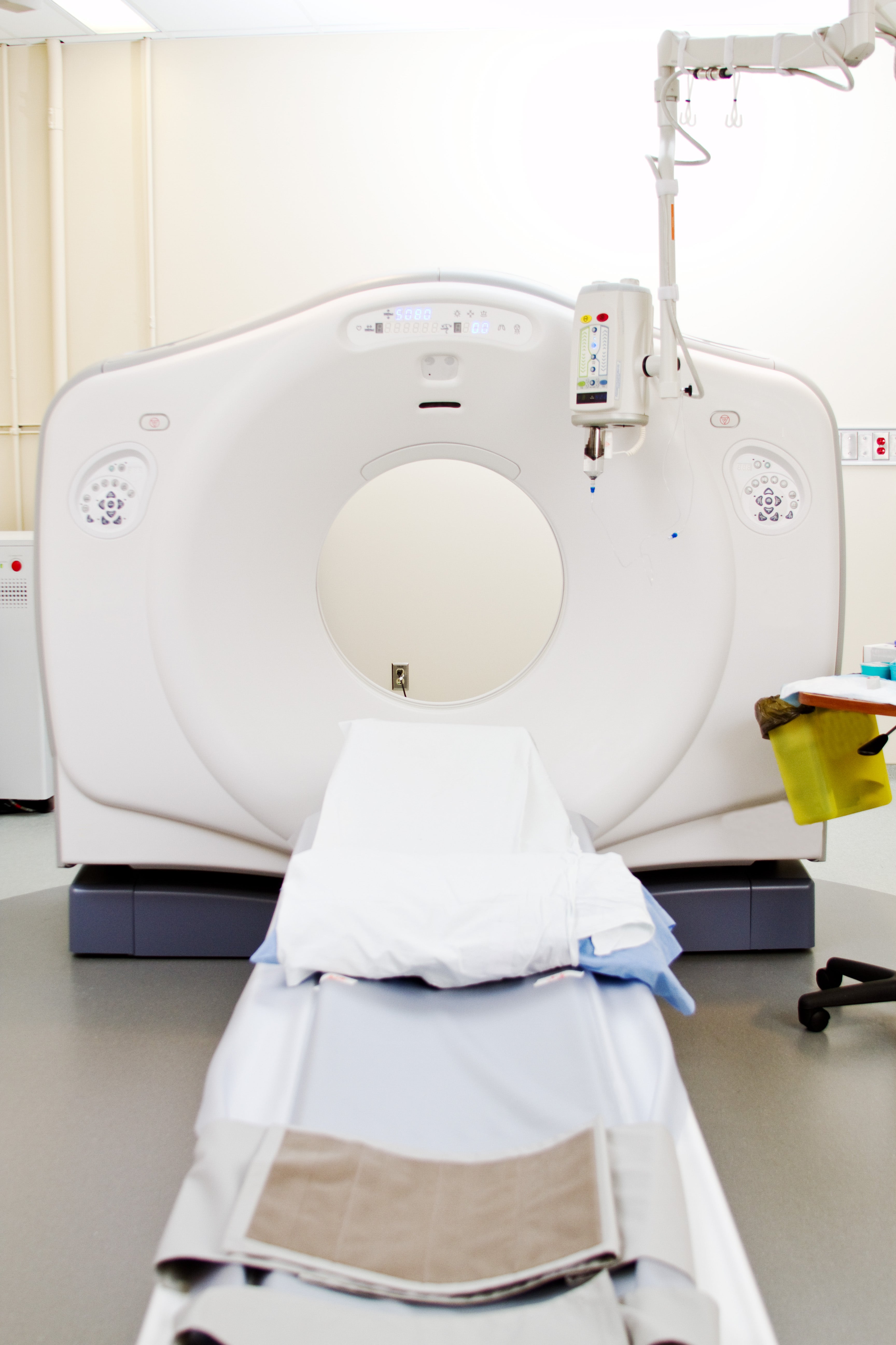 CT scanner ready for patient scan with contrast injector in medical facility