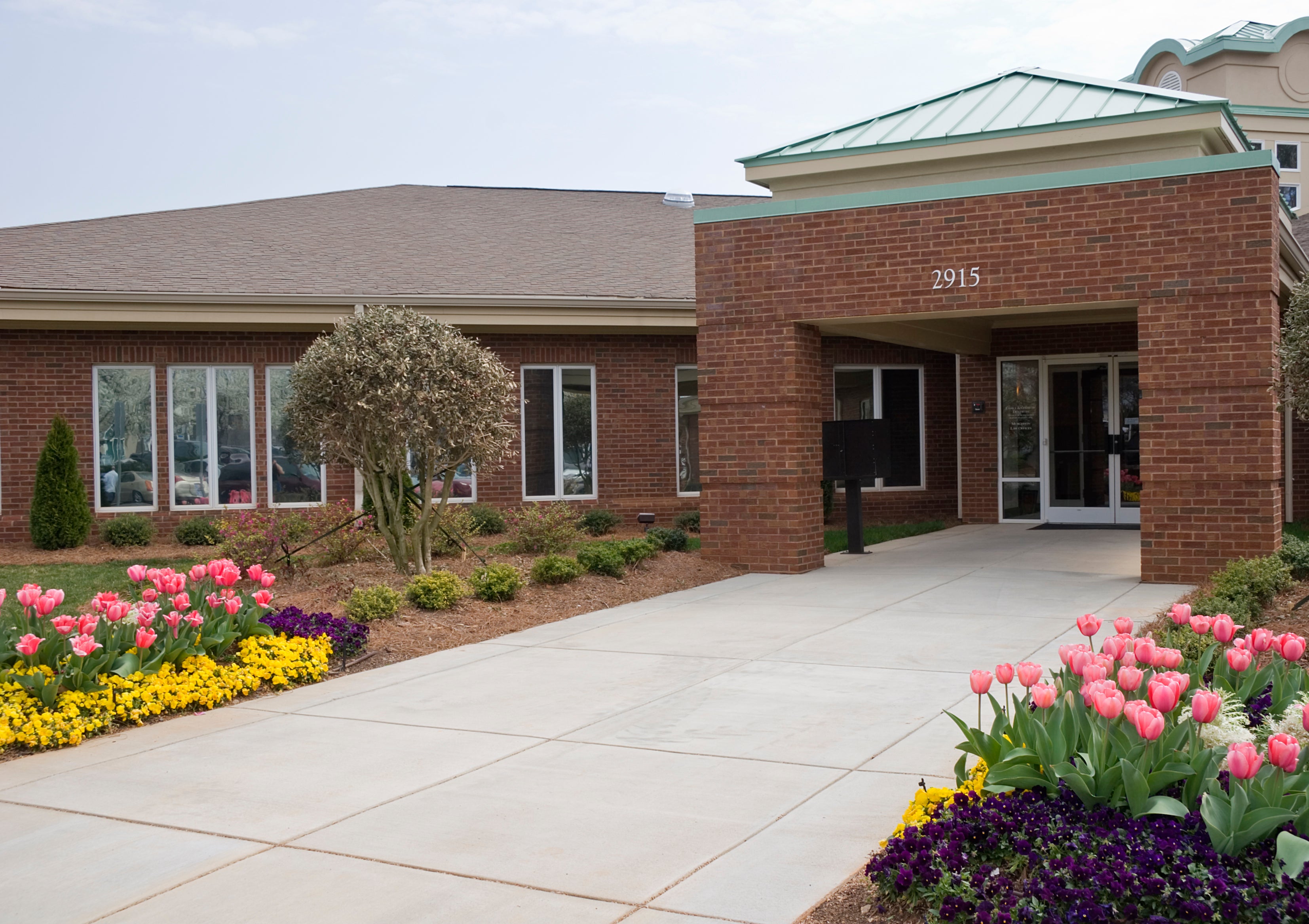 Medical imaging center building exterior with landscaped entrance