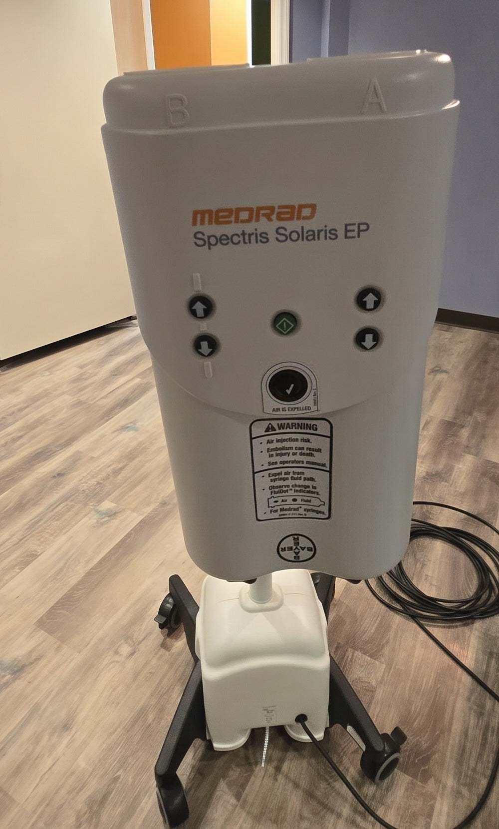 Medrad Spectris Solaris EP MRI contrast injector on its rolling pedestal stand